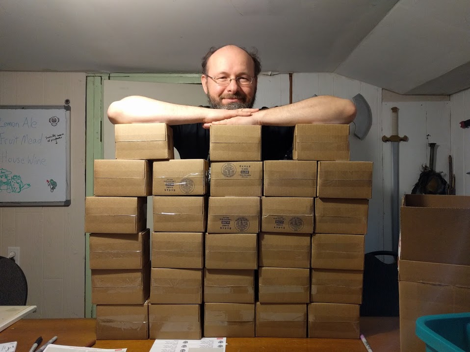 Tom with many boxes to send off to Kickstarter backers